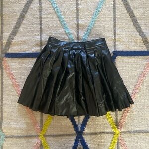 Black faux leather pleated mini skirt